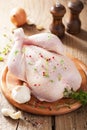 Whole raw chicken with rose pepper and thyme Royalty Free Stock Photo