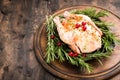 Whole raw chicken on wooden cutting board. raw chicken carcass Royalty Free Stock Photo