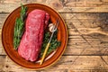 Whole Raw fillet Tenderloin beef meat for steaks. wooden background. Top view. Copy space