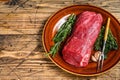 Whole Raw fillet Tenderloin beef meat for steaks. wooden background. Top view. Copy space