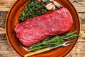 Whole Raw fillet Tenderloin beef meat for steaks. wooden background. Top view