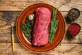 Whole Raw fillet Tenderloin beef veal meat for steaks. wooden background. Top view
