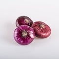 A whole red flat onion isolated on a white background