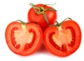 A whole red tomato cut into two halves is isolated on a white background Royalty Free Stock Photo