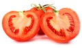 A whole red tomato cut into two halves is isolated on a white background Royalty Free Stock Photo