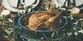 Whole roasted chicken decorated with olive tree branch, selective focus Royalty Free Stock Photo