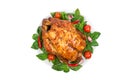 Whole roasted chicken grill on a plate with basil, tomatoes and chili pepper isolated on white background Royalty Free Stock Photo