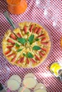 Whole round apple pie decorated with strawberry on a glass stand Royalty Free Stock Photo