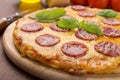 Whole Salami Pizza on a board Royalty Free Stock Photo