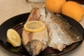 Whole on salt cooked fish with skin removed on one side .Whole fish cooked in a salt