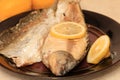 Whole on salt cooked fish with skin removed on one side .Whole fish cooked in a salt