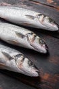 Whole sea bass on old fisherman wooden table side view