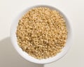 Whole Short Grain Rice Seed. Top view of grains in a bowl. White Royalty Free Stock Photo