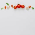 Whole slice cherry tomatoes garlic clove basil white background. High quality and resolution beautiful photo concept