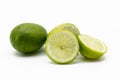whole and slice green Lemons isolated on white background Royalty Free Stock Photo