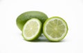 whole and slice green Lemons isolated on white background Royalty Free Stock Photo