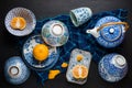 Whole and slice oranges fruits on ceramic plate