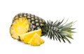 Whole with slice ripe pineapple on white