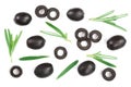 Whole and sliced black olives with rosemary leaves isolated on white background. Top view. Flat lay pattern Royalty Free Stock Photo