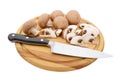 Whole and sliced chestnut mushrooms on board with knife Royalty Free Stock Photo