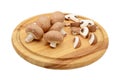 Whole and sliced chestnut mushrooms on a wooden cutting board Royalty Free Stock Photo