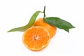 Whole and sliced clementine with leaf