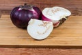 Whole and sliced eggplants Helios on the wooden cutting board Royalty Free Stock Photo