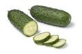 Whole and sliced fresh healthy snack cucumber close up on white background Royalty Free Stock Photo