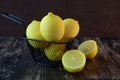 whole and sliced fresh orange fruit for a healthy diet on a dark background