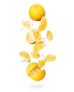 Whole and sliced fresh oranges in the air, isolated on a white background Royalty Free Stock Photo