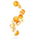 Whole and sliced fresh oranges in the air on a white background Royalty Free Stock Photo