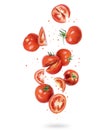 Whole and sliced fresh tomatoes in the air, isolated on a white background Royalty Free Stock Photo