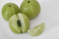 Whole and sliced gooseberries or Amala on white
