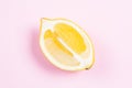 Whole and sliced lemon on pink background Royalty Free Stock Photo