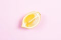 Whole and sliced lemon on pink background Royalty Free Stock Photo