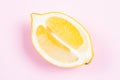 Whole and sliced lemon on pink background Royalty Free Stock Photo