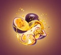 Whole and sliced passion fruit with splashes of juice closeup Royalty Free Stock Photo