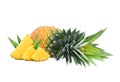 Whole and slices ripe pineapple with leaves isolated on white