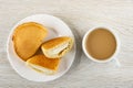 Sochen with cottage cheese and  halves of curd envelope in plate, cup of coffee with milk on table. Top view Royalty Free Stock Photo