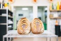 whole sourdough loaves cooling on a wire rack in a bakery