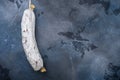 Whole spanish salchichon wurst on blue background, top view with copy space Royalty Free Stock Photo