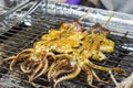 Whole squid barbecued on grill