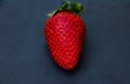 Whole strawberries with a dark slate background Royalty Free Stock Photo