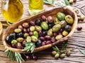 Whole table olives in the wooden bowl. Royalty Free Stock Photo