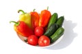 Whole Vegetables Cucumbers, Bell Peppers and Tomatos red green yellow orange in water drops on white background Isolated top view Royalty Free Stock Photo