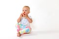 Whole view of toddler girl eating red apple Royalty Free Stock Photo