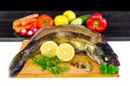 Whole walleye fish with vegetables