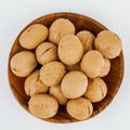 Whole walnut in a wooden bowl. On white background. Royalty Free Stock Photo