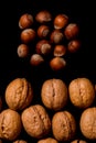 Whole walnuts and cleared on old black metal background, top view. Space for text Royalty Free Stock Photo