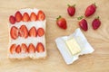 Whole wheat bread and pieces of strawberry and fresh butter Royalty Free Stock Photo